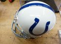 Picture of PEYTON MANNING AUTOGRAPHED MINI HELMET AND SIGNED FOOTBALL CARD; COA; CASE. MINT CONDITION. COLLECTIBLE.