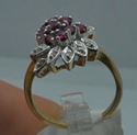 Picture of 14KT YELLOW  GOLD CLUSTER RING SIZE 7 5 GRAMS WITH 10 ROUND DIAMONDS 0.10PTS; RED STONES.  PRE OWNED. VERY GOOD CONDITION. 853791-1.